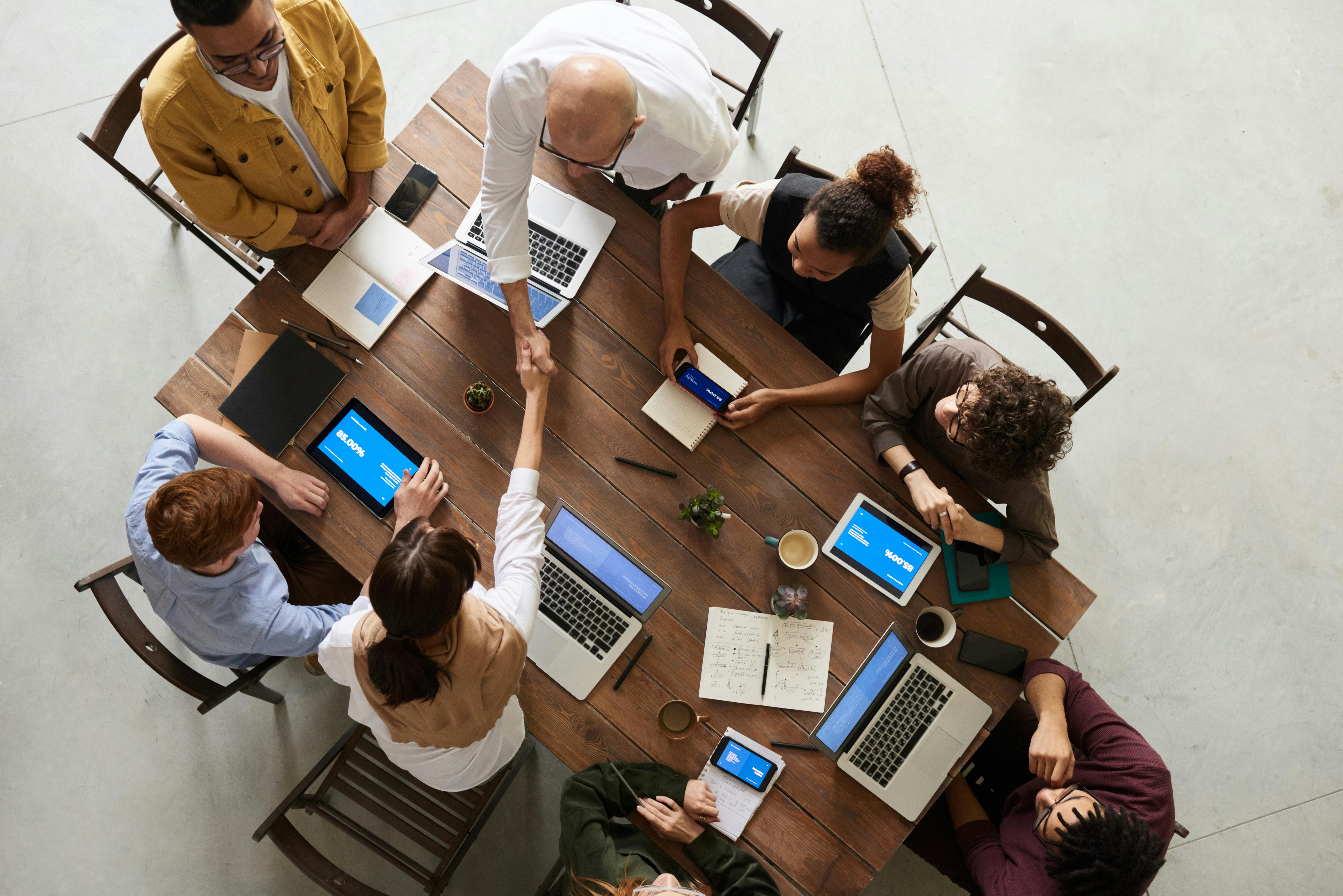 Professionals discussing a project around a table